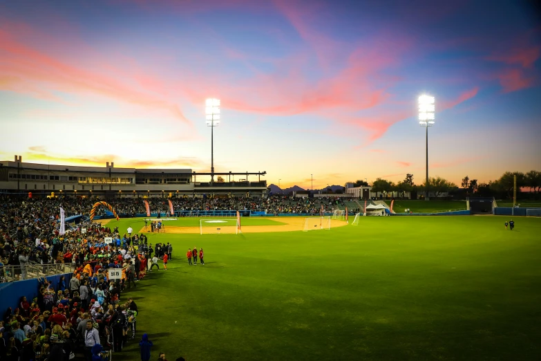 a group of people on a field playing baseball