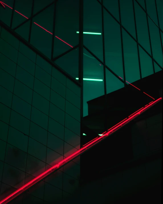 neon lights shine on a wall with a green glow
