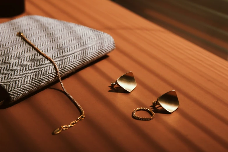 jewelry sits on top of a cloth bag