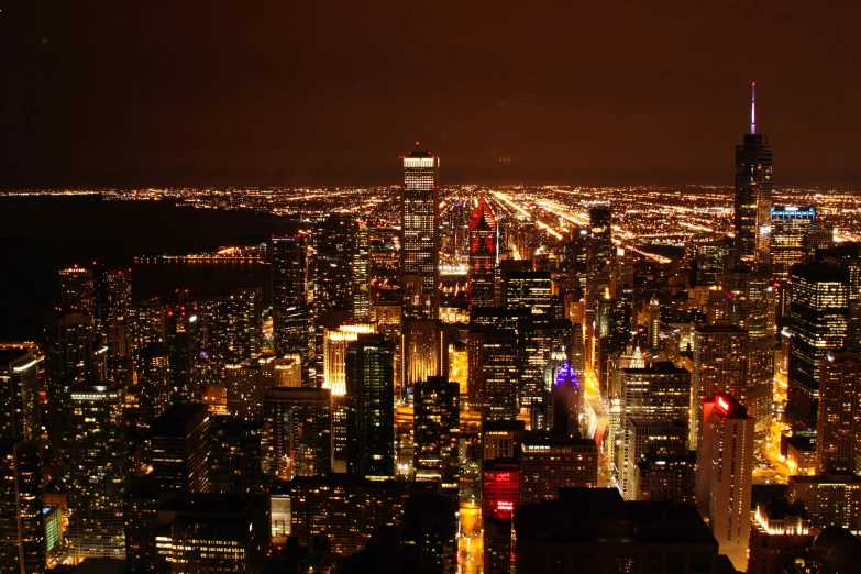 a view of a city at night from the top of a building