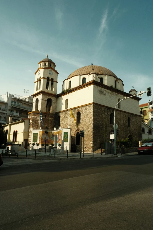 a large church is on the corner of the street