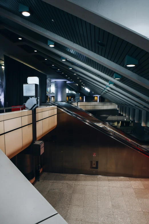 there is a view of an escalator and a building from inside