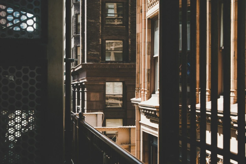 light falls from windows and onto the outside of a building