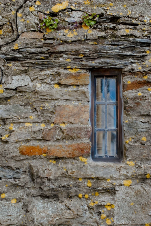 a window in the side of a stone wall