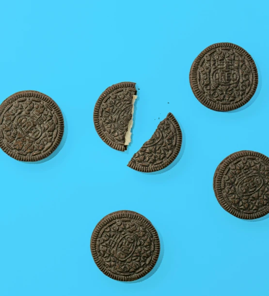 there are four oreos broken up into pieces