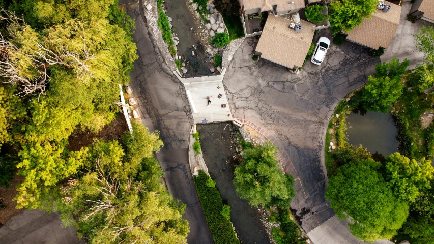 top view of the roads with trucks in an area of forest