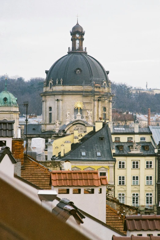 looking over some rooftop tops at old buildings