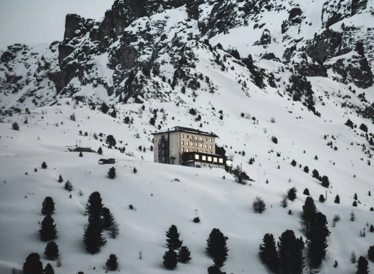 there is a building sitting on the top of the mountain