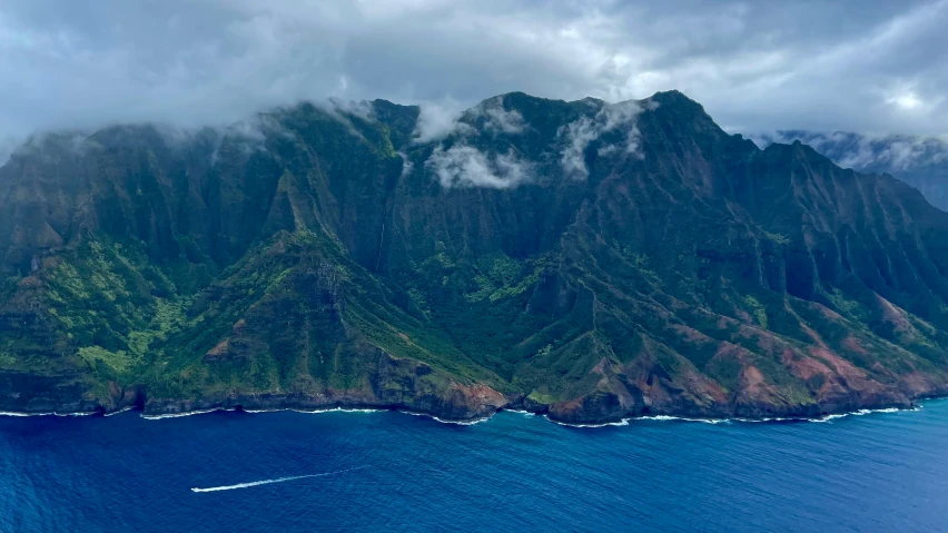 an aerial po of a lush green mountainous area