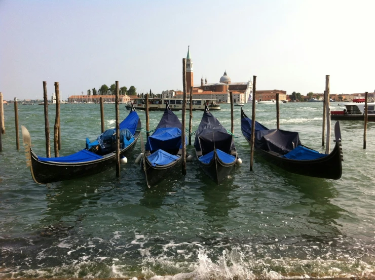 a group of boats sitting on top of a body of water