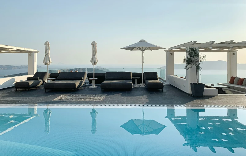 outdoor seating set along the pool overlooking the ocean