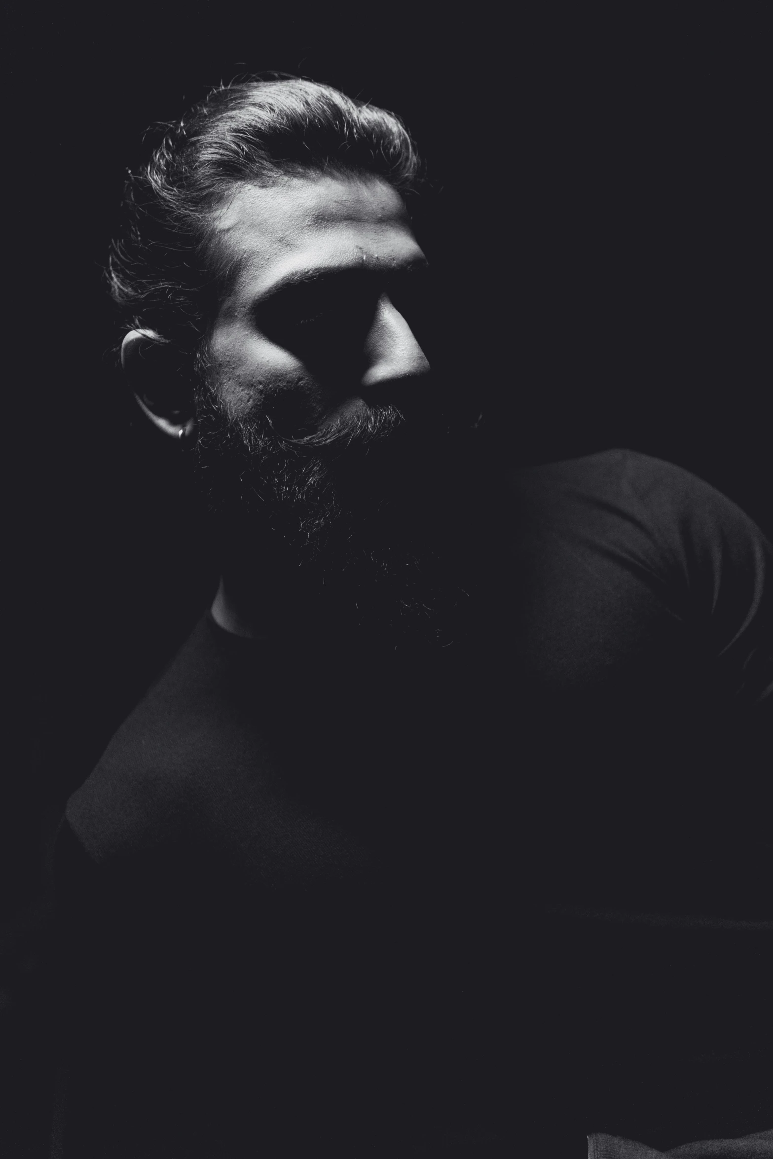 black and white portrait of man with beard and hair