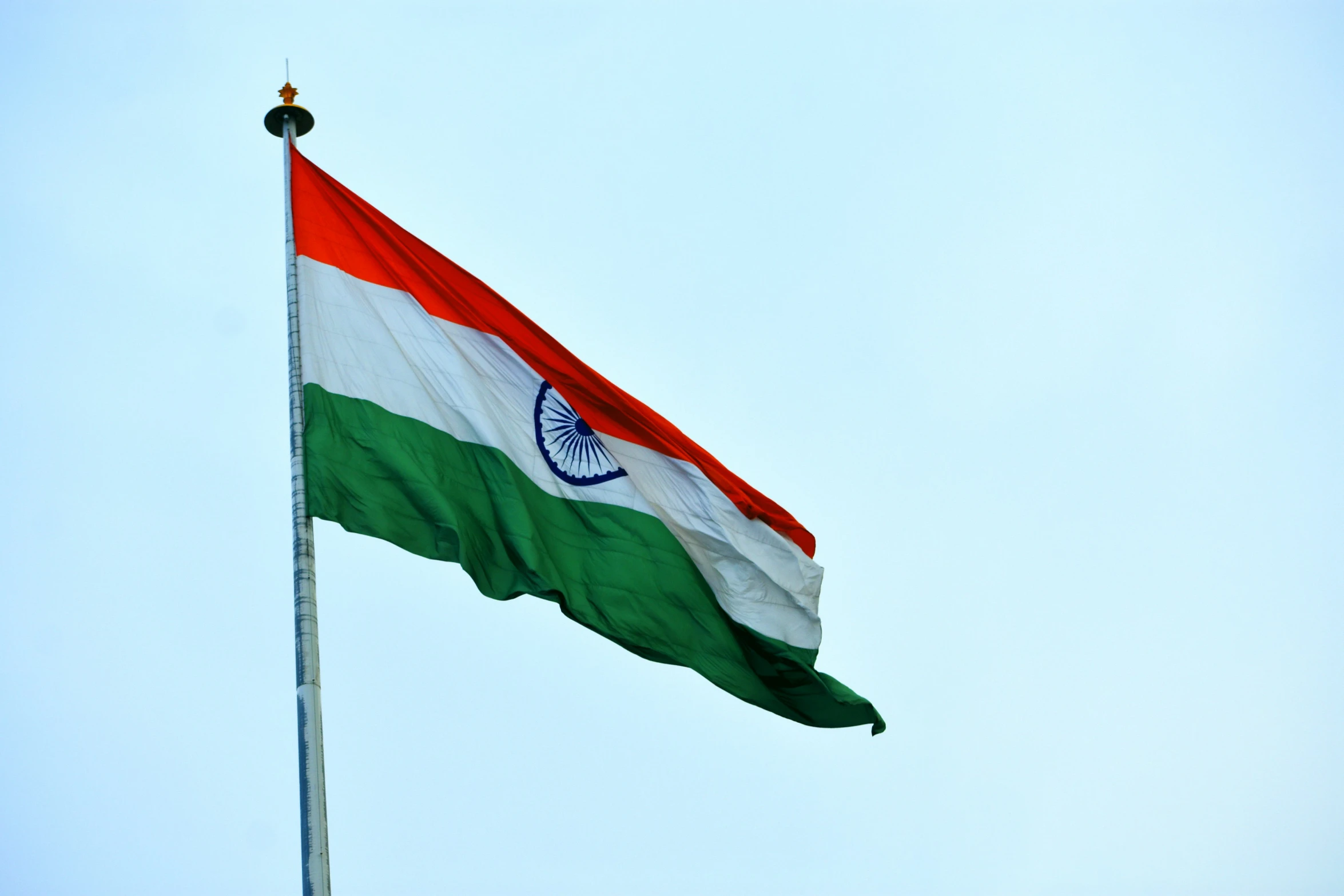 the indian flag flies in the wind