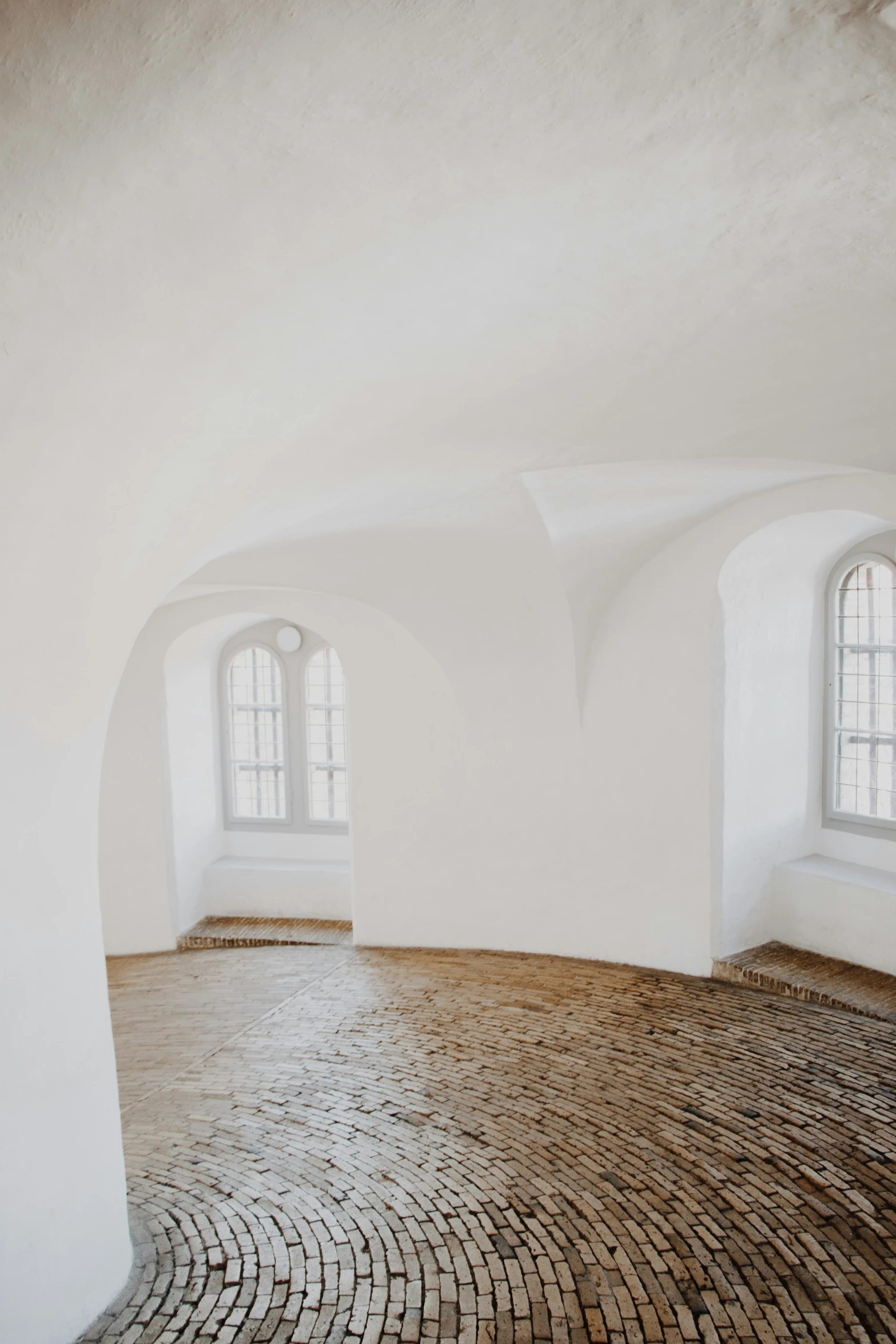 a white empty room with many windows