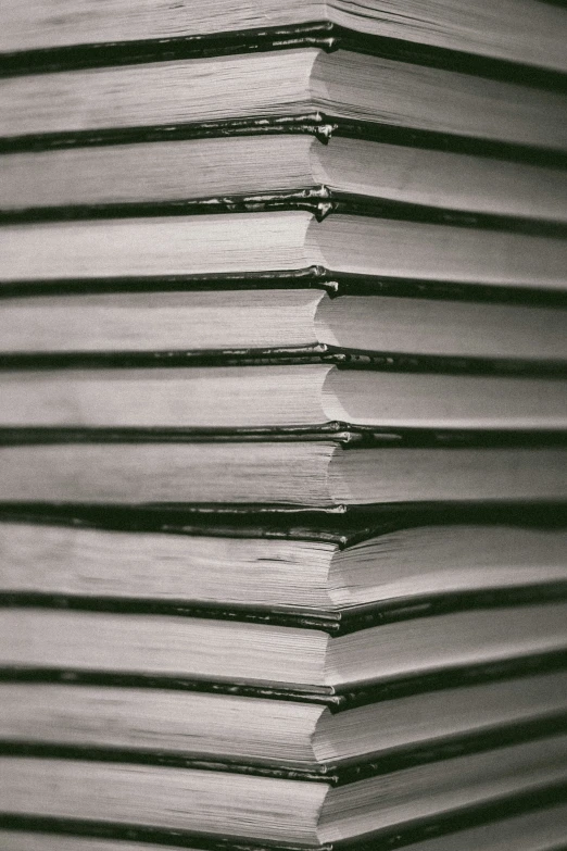 the stacks of books are shown in black and white