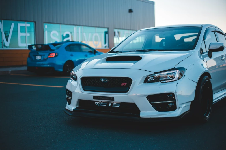 the front view of the car in a parking lot