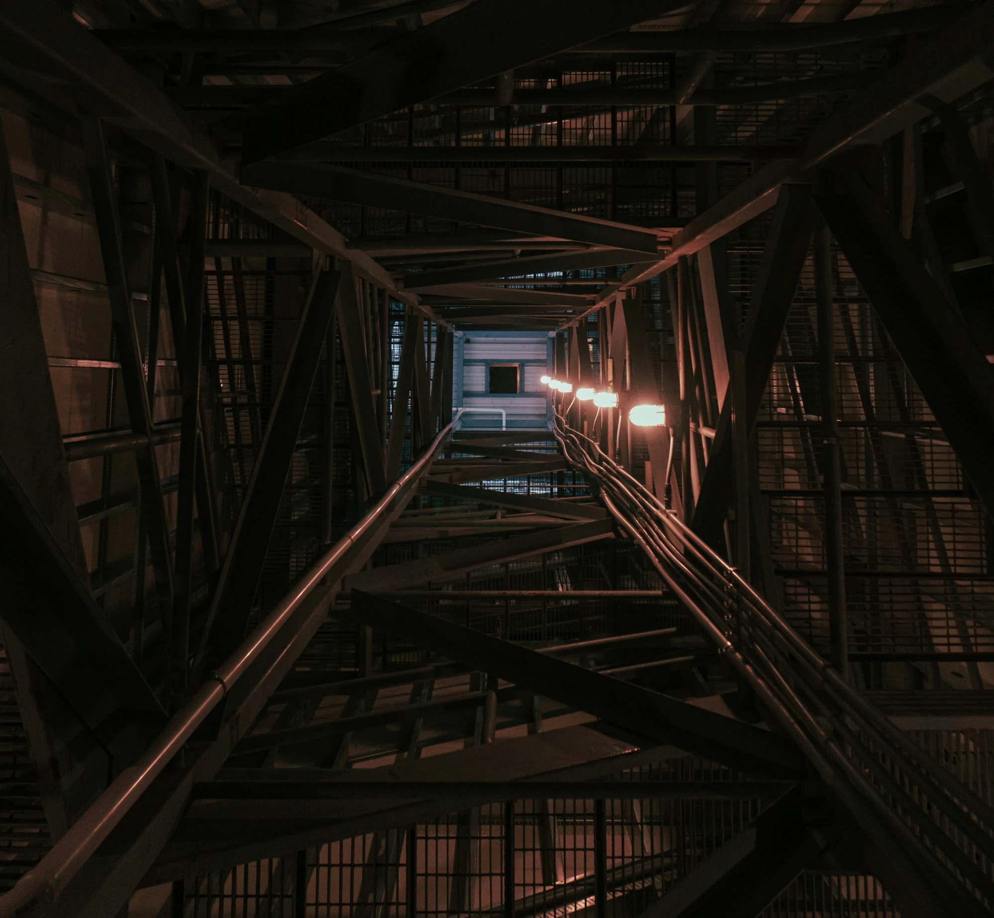 the view looking down on some tracks going underneath a building