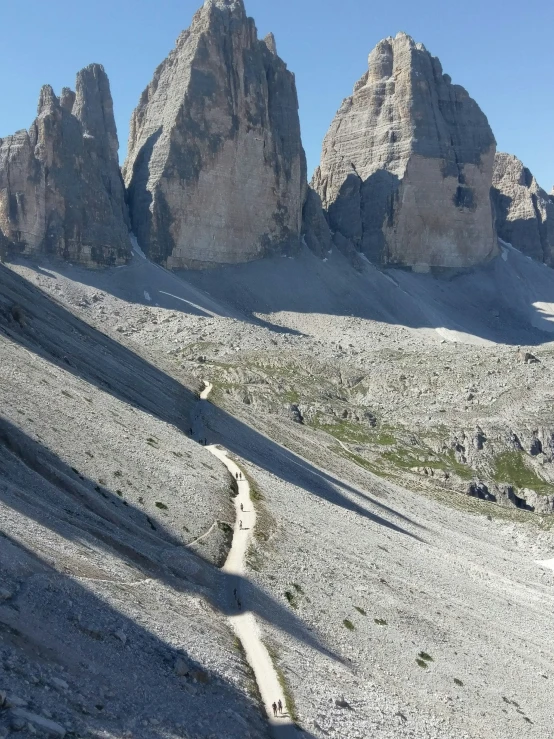 some large mountains with little snow on them