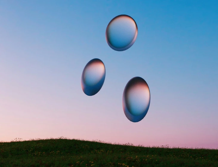 two different colored balls floating in the air