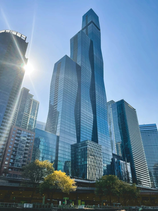 a city view of several tall skyscrs at sunset