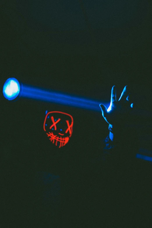 a close up of a hand and a lite with a flashlight