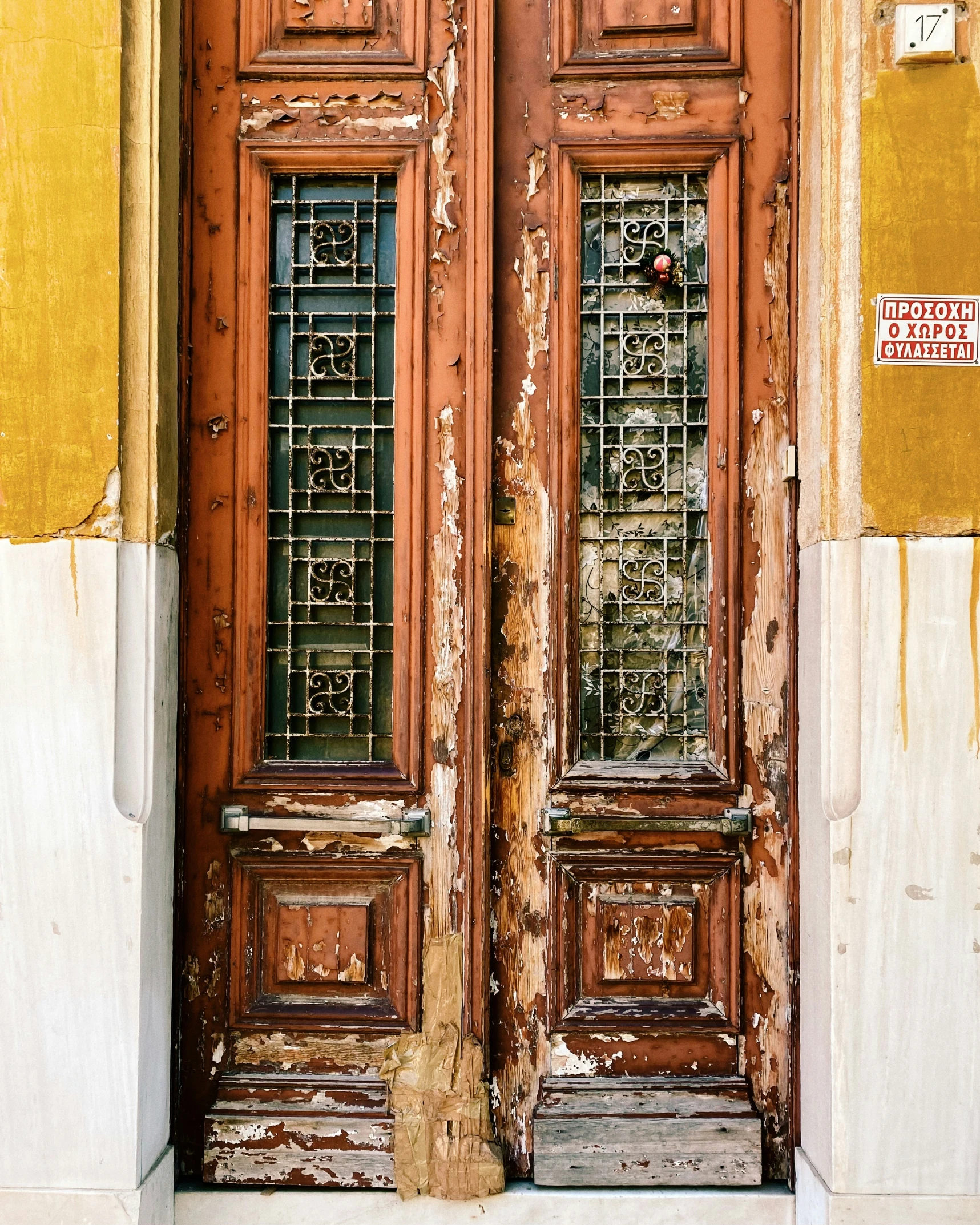 the old doors have stained glass panels on them