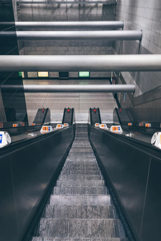 an empty escalator at the top of the hill