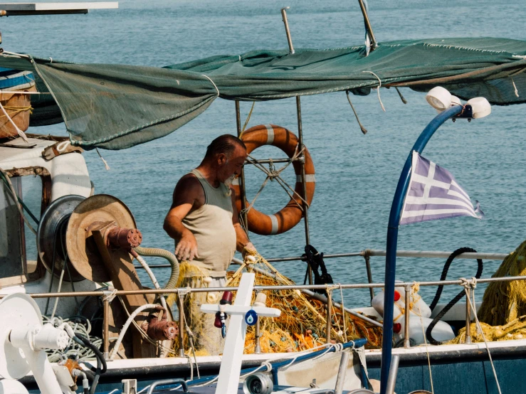 the man in the boat looks around the bow