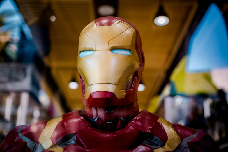 a close up of an iron man model in a suit