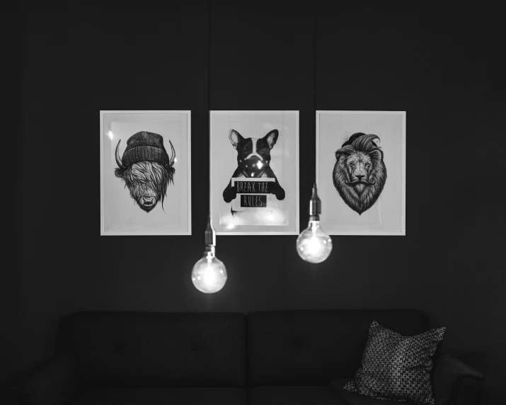 a living room with two hanging pictures on the wall