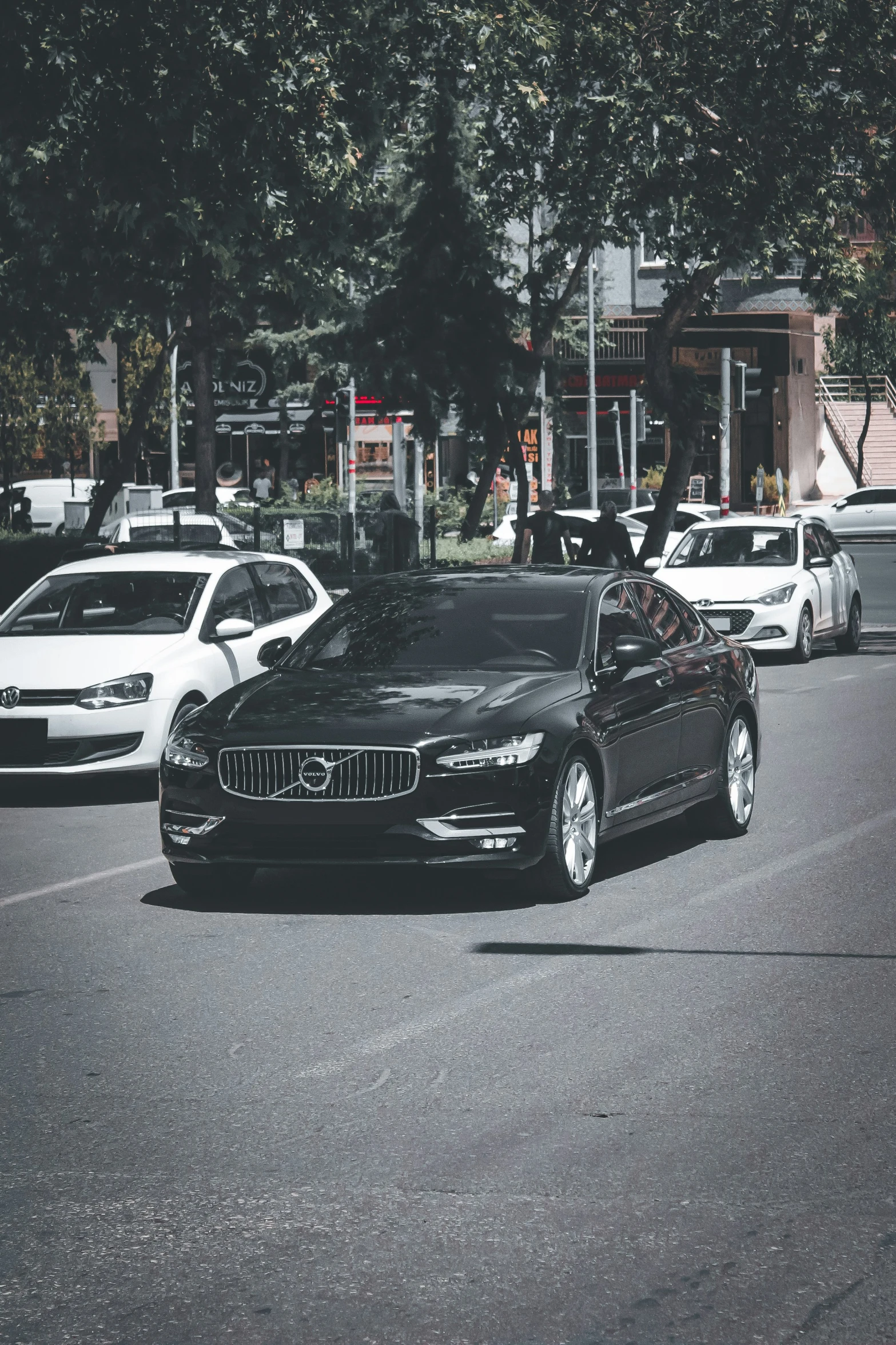 a street scene with cars parked in a row