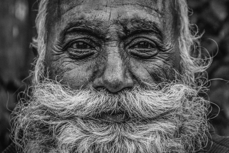 an old man with long white beard and mustache