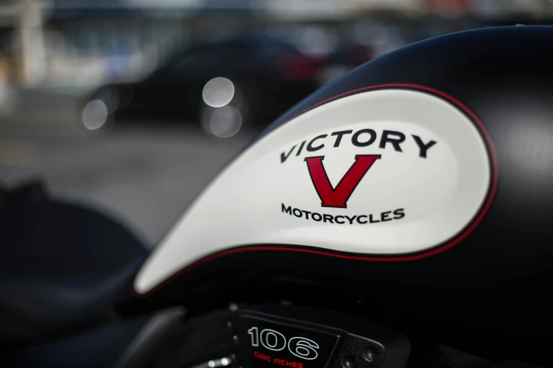 the tailgate of a motorcycle with a victory v logo