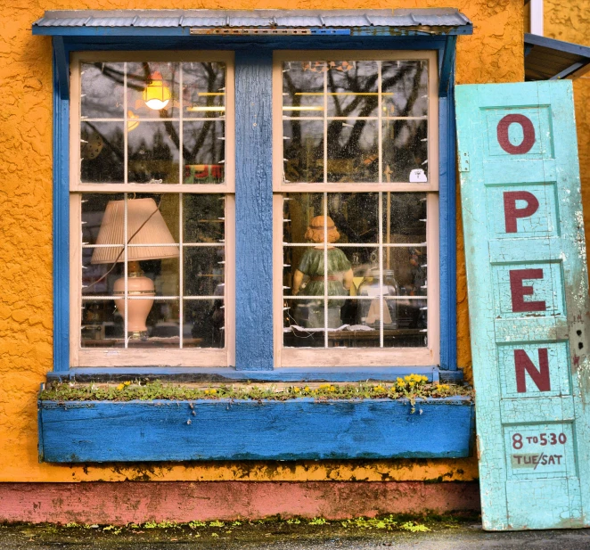 a building with open signs and windows