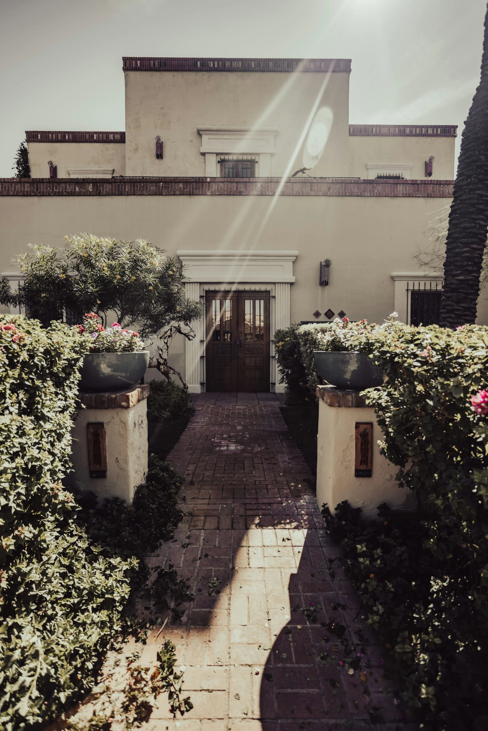 a house with several flower boxes and landscaping around it