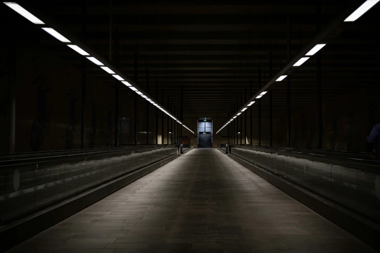 long tunnel with light from above at night