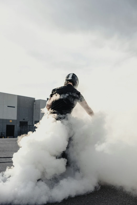 a person is doing some smoking with one hand