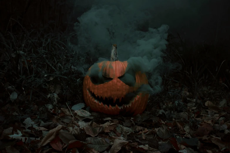 an eerie po of a halloween pumpkin in the grass