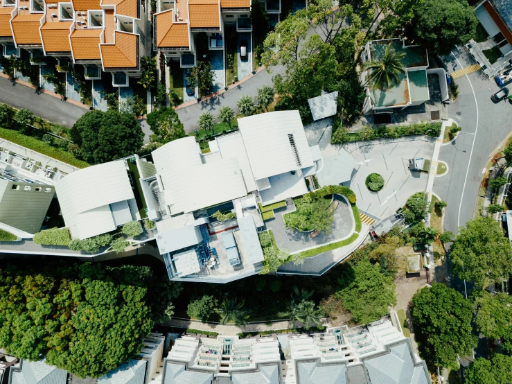 a futuristic architectural complex with plants and trees