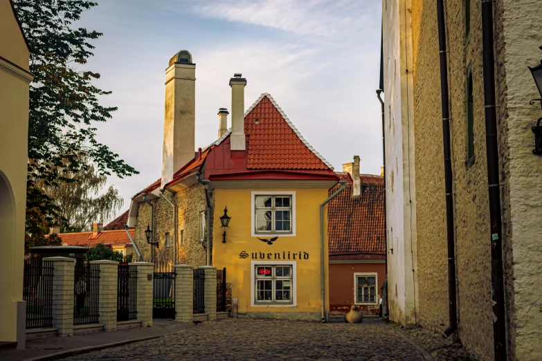 a yellow building in an old part of town