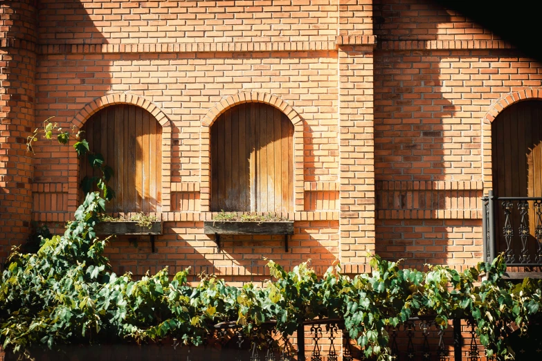 an old brick building with some doors and windows