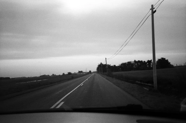 the view from inside of a vehicle on the road