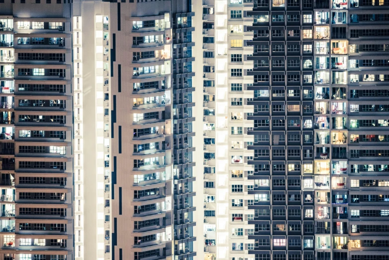 the windows of some high rise apartment buildings at night