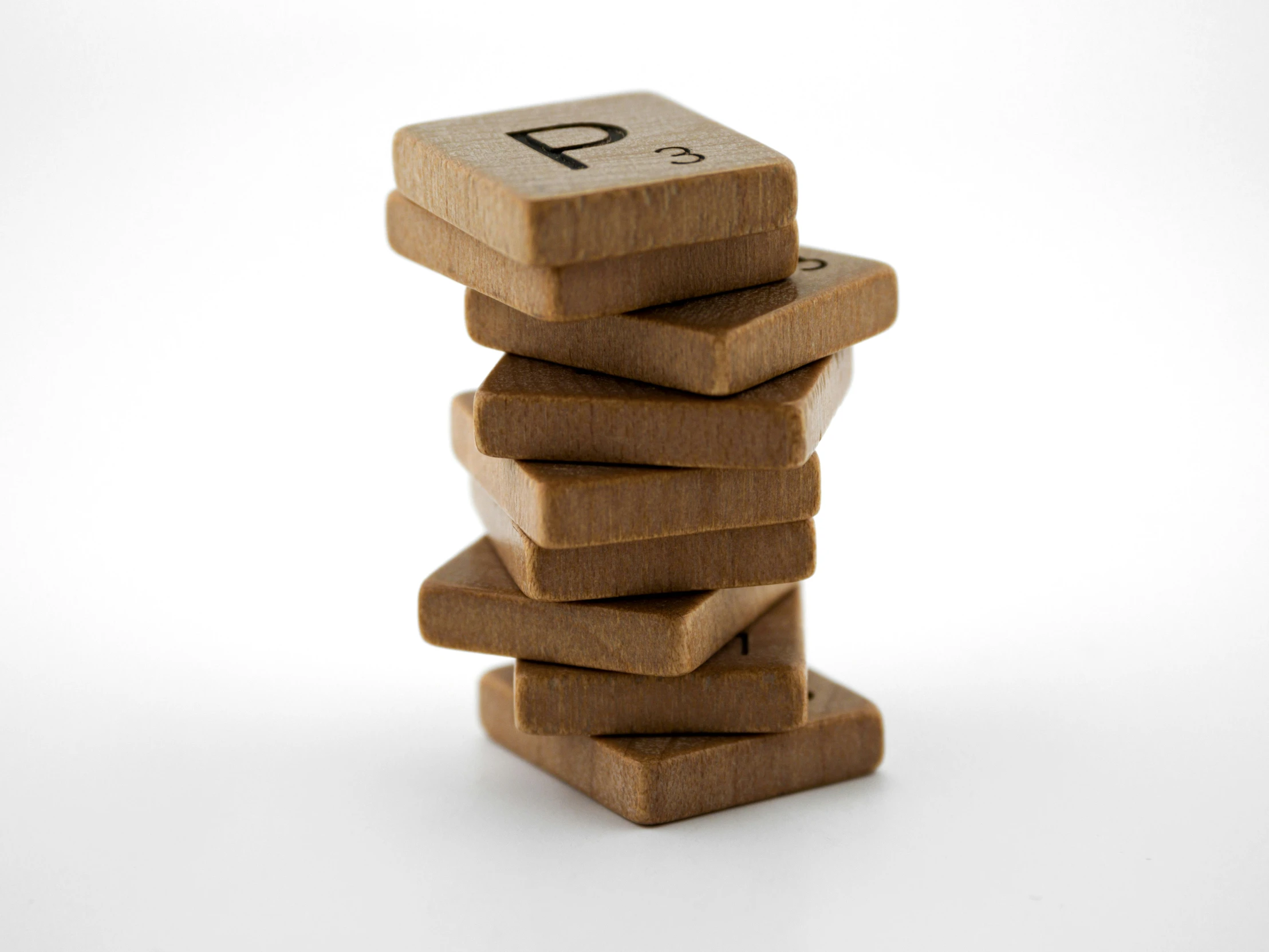 a stack of wooden blocks with a pune in it