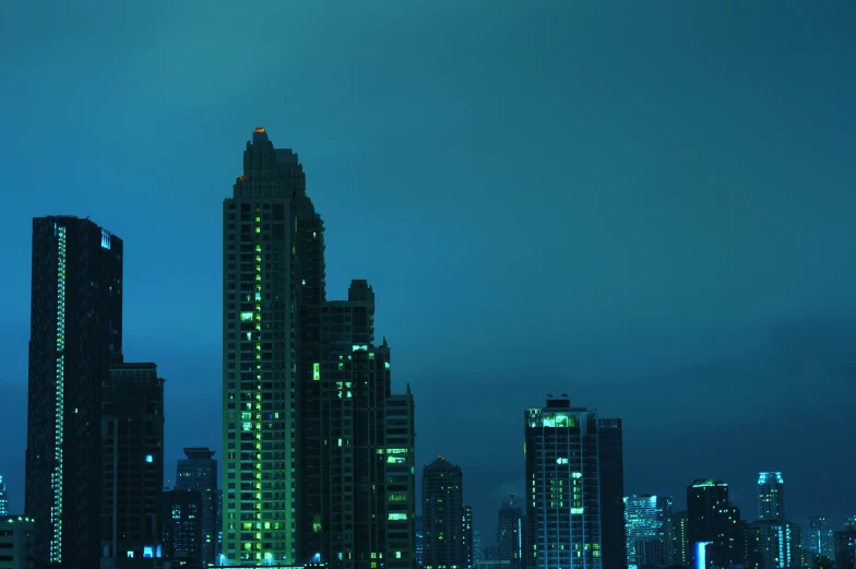 a view of the skyline with the city lights lit at night