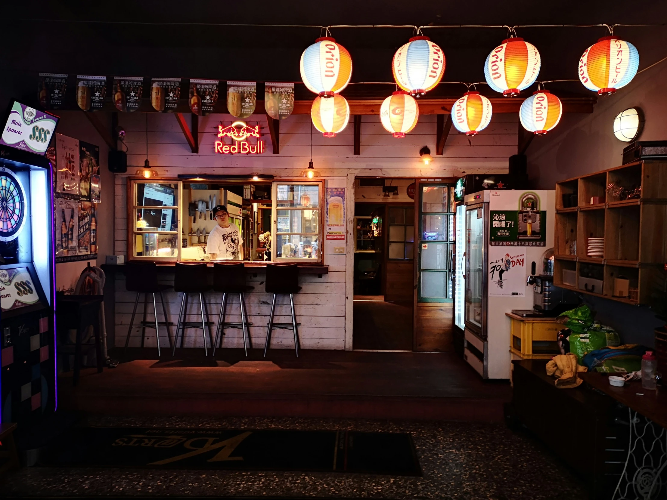 a small bar with many lights on the ceiling