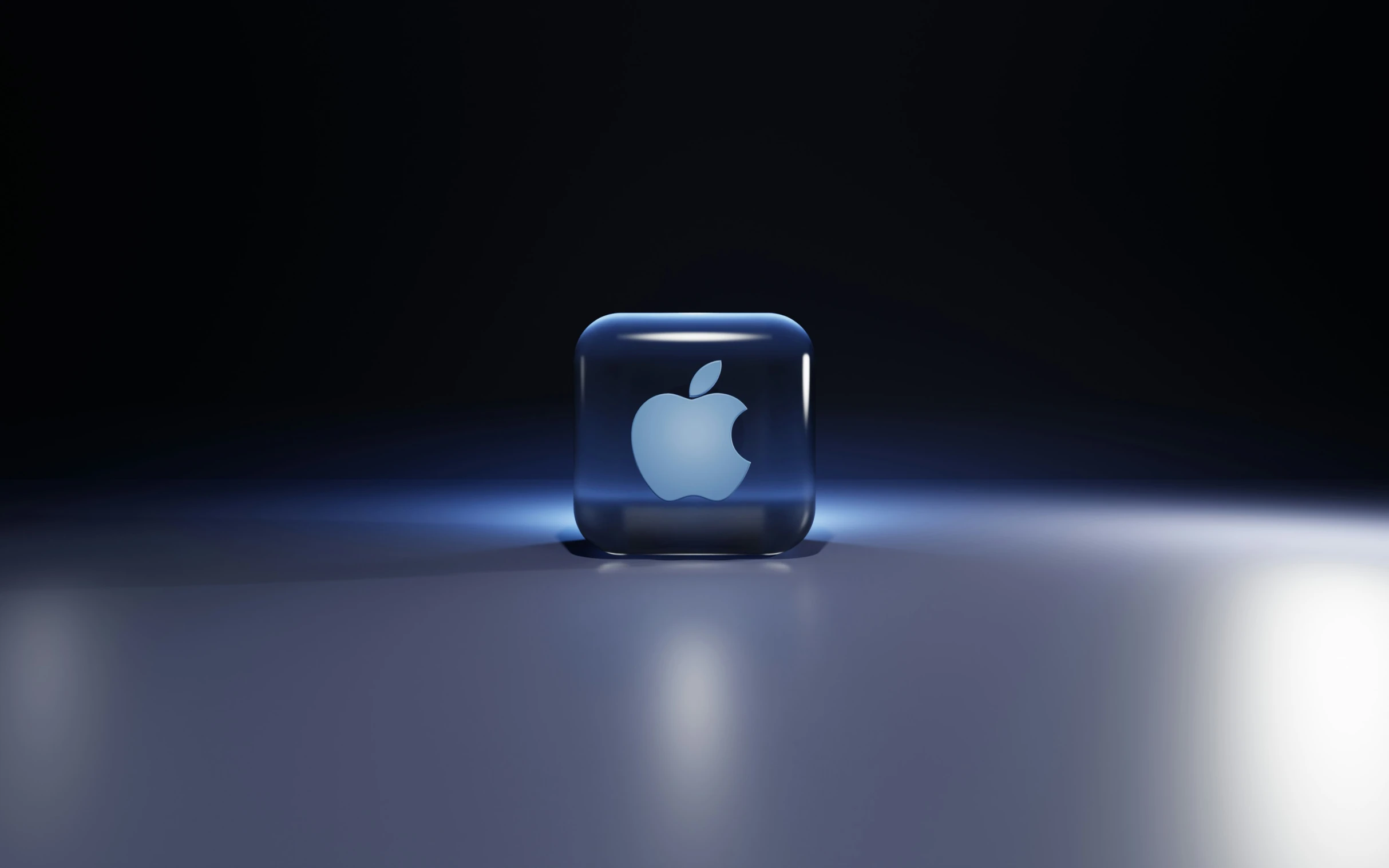 an apple app logo on the back side of the mac desktop