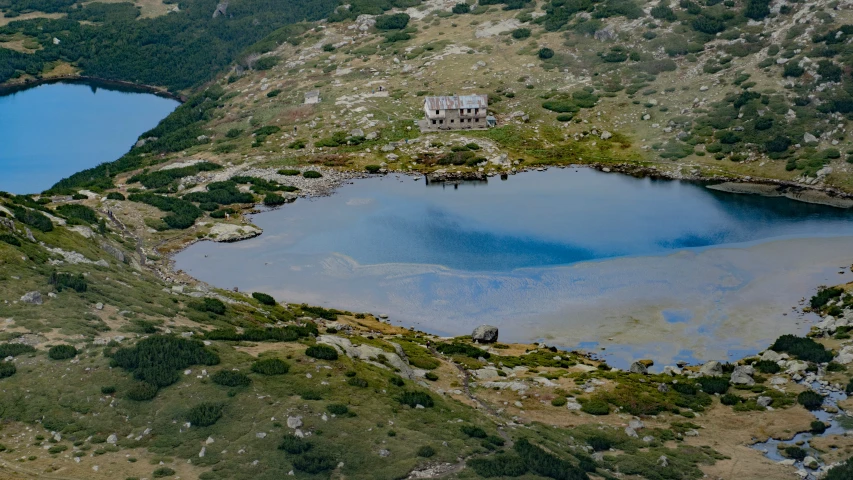 there are two lakes in the area with a house on them