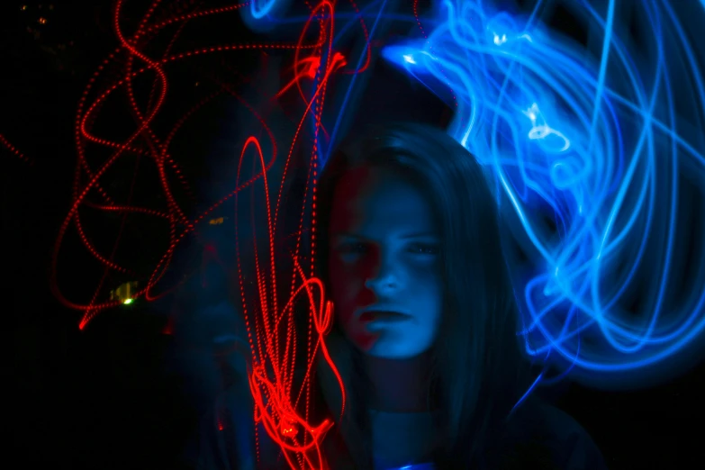 a person with long hair and red light