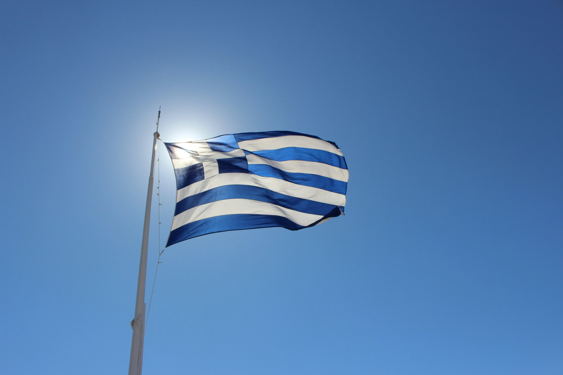 a blue and white flag with an odd shaped design in the top